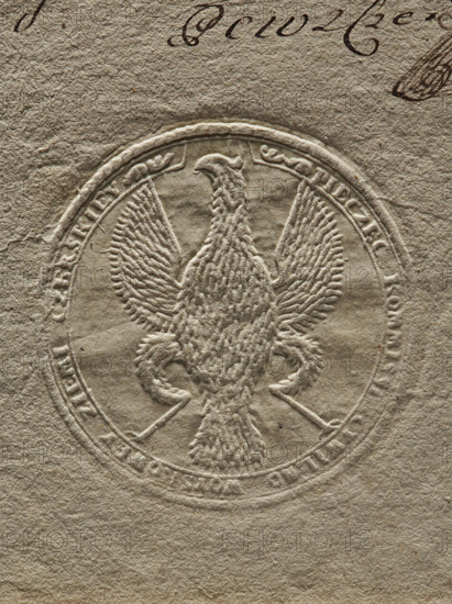 Seal of the Civil-Military Order Commission of the Czersk Land. Round dry impression of the seal. In the field, an eagle without a crown. Around the rim the inscription: 'PIECZEC KOMMISSI CYWILNO WOYSKOWEY ZIEMI CZERSKIEJ'. Dated 1792. Poland, Czersk Land. Made by Zurakowski, Witold (?-1927). Document seal; seals with an eagle; seals with provincial coats of arms; official seal., The image shows an embossed circular seal pressed into textured paper, featuring a raised eagle with outstretched wings and detailed feather texture, its head turned to one side and talons gripping curved objects; the paper and embossing are in shades of beige, tan, and light brown, with a few darker brown ink marks partially visible near the top edge.