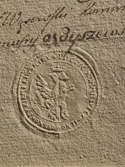 Seal of the Civil-Military Order Commission of the Liw Land, dry impression, Zurakowski, Witold (?-1927). Round impression of the seal. In the field: a half-eagle and a south-bear under a common crown. Around the rim: inscription 'PIECZEC KOMMISSYI CYWILNO WOYSKOWEY ZIEM LIWSKIEY, 1790'. Poland, Liw Land., The image shows a textured, tan-colored paper surface with a raised circular embossed seal near the center featuring a winged lion standing on its hind legs and wearing a small crown, surrounded by concentric raised rings. Above the seal there is a section of handwritten script in dark brown ink with flowing cursive strokes. The overall colors visible are tan, beige, and dark brown.