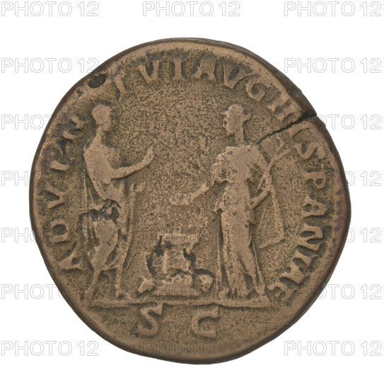 Sestertius of Hadrian (76–138; Roman Emperor 117–138). Obverse: bust of Hadrian facing right in drapery; rim inscription HADRIANVSAVG COS III PP. Reverse: Hadrian, in a toga, stands facing right, holds a scroll in his left hand and raises his right hand toward the personification of Spain, who stands opposite him; Spain consecrates gifts with her right hand on an altar between them, holds a branch in her left hand, a small bull next to the altar; control mark SC; rim inscription ADVENTVS AVG HISPANIAE. Date: 134–138. Rome, Roman Empire (27 BC–476). Coin; weight 23.92 g.