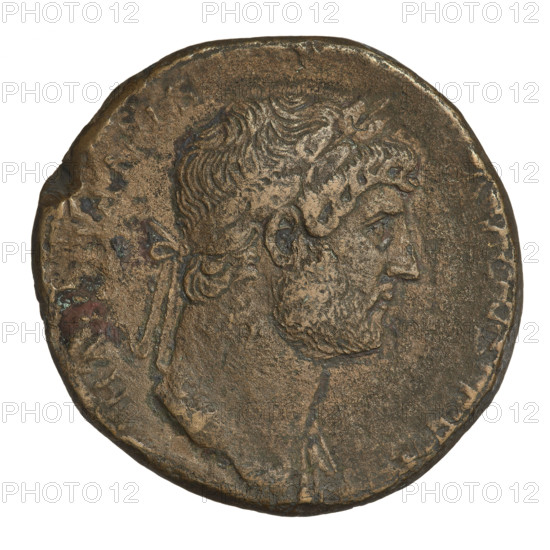 sestertius, Hadrian (76–138; Roman emperor 117–138); Obverse: bust of Hadrian with laurel wreath facing right; rim inscription obliterated. Reverse: Virtus standing left, dressed in military attire, wearing a helmet, right foot on a helmet, parazonium in right hand, spear in left hand upright; rim inscription COS III; on both sides: SC. 121–122, Rome, Roman Empire (27 BC–476). Coin; weight 25.06 g.