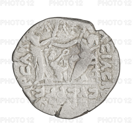 Tetradrachm of Artabanos II (king of Parthia; 10–40 AD). Obverse: bust of Artabanos II facing left, wearing a diadem and armor. Reverse: Artabanos seated on a throne facing left, receiving a palm from a standing woman (possibly Nike); at his feet a kneeling male figure holds a wreath in his outstretched right hand. Iconography: wreaths, palms, Nike standing. Parthian Kingdom, Iran. Coin. Diameter 24.0 × 26.0 mm; weight 13.55 g.