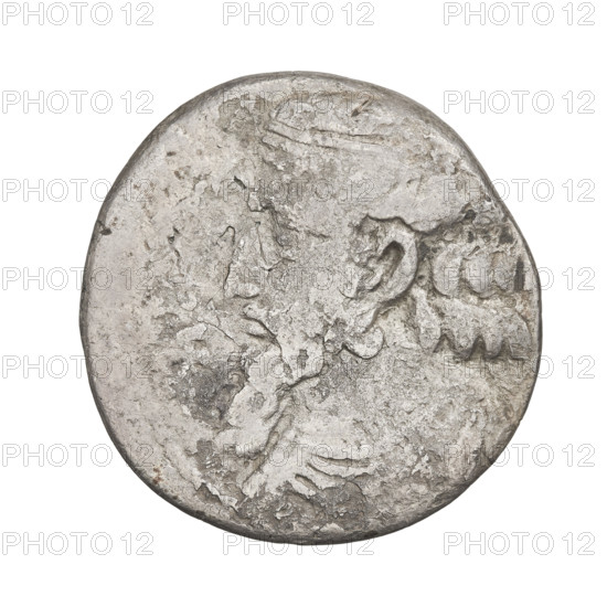 Tetradrachm of Artabanos II (king of Parthia; 10–40 AD). Obverse: bust of Artabanos II left, wearing a diadem and armor. Reverse: Artabanos seated facing left, receiving a palm from a standing woman (Nike?), with a kneeling male figure at his feet holding a wreath in his outstretched right hand. Parthian Kingdom, Iran. Coin. Diameter 26.0 × 27.0 mm; weight 11.58 g.
