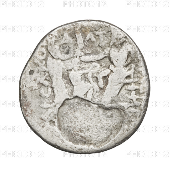 Tetradrachm of Artabanos II (king of Parthia; 10–40 AD). Obverse: bust of Artabanos II left, wearing a diadem and armor. Reverse: Artabanos seated facing left, accepting a palm from a standing female figure (possibly Nike); at his feet a kneeling male figure holds a wreath in his outstretched right hand. Parthian Kingdom, Iran. Coin diameter 26.0 × 27.0 mm; weight 11.58 g.