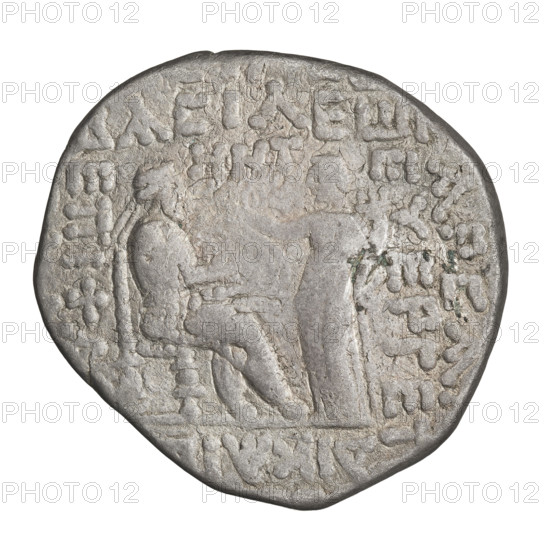 Tetradrachm of Gotarzes II (Parthian king, reign 40–51 CE). Obverse: bust of Gotarzes II facing left, with long beard, curled hair, wearing a diadem, necklace and cuirass. Reverse: Gotarzes II facing right, seated on a throne, with Tyche (personification) standing before him, placing a diadem on him with her right hand and holding a cornucopia in her left. Date: c. 38–51 CE. Parthia (Iran). Coin; diameter 26.0–27.0 mm, weight 13.50 g.