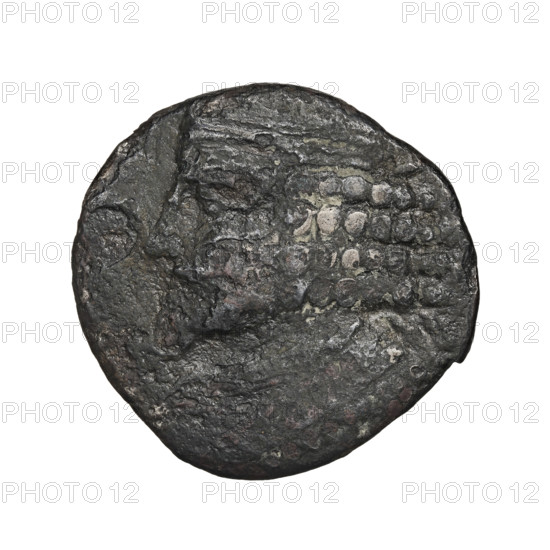Bronze coin of Gotarzes II (king of the Parthians; reign 40–51). Obverse: bust of Gotarzes II facing left, with long beard, curled hair, wearing a diadem, necklace, and cuirass. Reverse: Gotarzes II facing right, seated on a throne; Tyche standing in front of him, giving him a diadem in her right hand and holding a cornucopia in her left. Minted at Seleucia on the Tigris, Parthia (Iran), dated 38–51. Coin diameter 24.5–25.5 mm, weight 10.50 g.