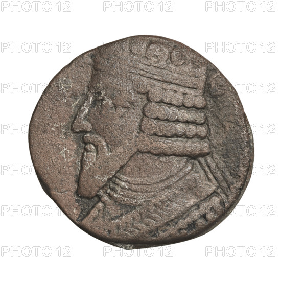 Bronze coin of Gotarzes II (king of the Parthians, reign 40–51 CE). Obverse: bust of Gotarzes II facing left. Reverse: Gotarzes II facing right, seated on a throne; Tyche (personification) standing before him, offering a diadem with her right hand and holding a cornucopia in her left. Parthian Kingdom, Iran. Date: 38–51 CE. Weight: 12.45 g.