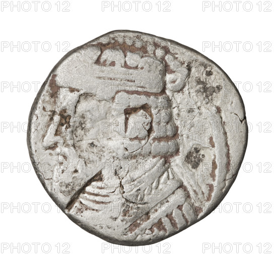 Tetradrachm of Gotarzes II (king of the Parthians; 40–51). Obverse: bust of Gotarzes II facing left, with long beard, curled hair, wearing a diadem, necklace, and cuirass. Reverse: Gotarzes II facing right, seated on a throne; Tyche (personification) standing in front of him, giving him a diadem in her right hand and holding a cornucopia in her left. Parthian Kingdom, Iran, 38–51. Coin; diameter 25.0 × 26.0 mm, weight 12.85 g.