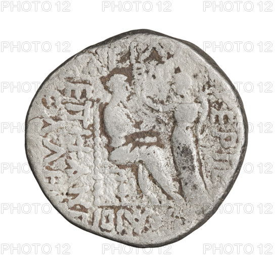 Tetradrachm of Gotarzes II (king of the Parthians; reign ca. 40–51). Obverse: bust of Gotarzes II facing left with long beard, curled hair, wearing a diadem, necklace and cuirass. Reverse: Gotarzes II facing right, seated on a throne; Tyche (personification) standing before him, offering a diadem in her right hand and holding a cornucopia in her left. Parthian Kingdom, Iran; dated ca. 38–51. Coin; diameter 25.0–26.0 mm, weight 12.85 g.