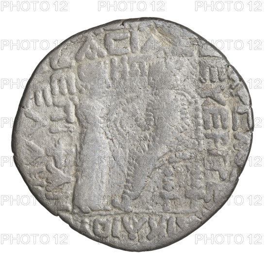 Tetradrachm of Vardanes II (55–58 CE). Obverse: bust of Vardanes II wearing a diadem, facing left. Reverse: Vardanes II seated on a throne facing left, with Tyche (personification) holding a wreath in front of him. Parthian Kingdom, Iran. Coin; diameter 28.0–29.5 mm, weight 12.57 g.