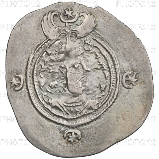 Drachma, Chosroes II Parwiz (ruler of Persia; 590–628). Obverse: bust of Chosroes II right, wearing a crown decorated with two wings, a crescent and a star; left of crown a star, right a star in a crescent; beads on the neck and a central triangle of three dots; behind the crown two ribbons; double pearl border; behind the border at the bottom and on both sides a crescent with a star; Pahlavi legend. Reverse: fire altar; left of altar the ruler shown facing forward with a sword in his hand; right of altar a priest facing forward holding a sword; top left a star, top right a crescent; signs/monograms on both sides; triple pearl border; beyond it four crescents with stars; Pahlavi legend. Date: 590–628. Place: Persia (Iran). Object: coin (drachma). Diameter: 30.0 × 32.0 mm. Weight: 4.90 g.