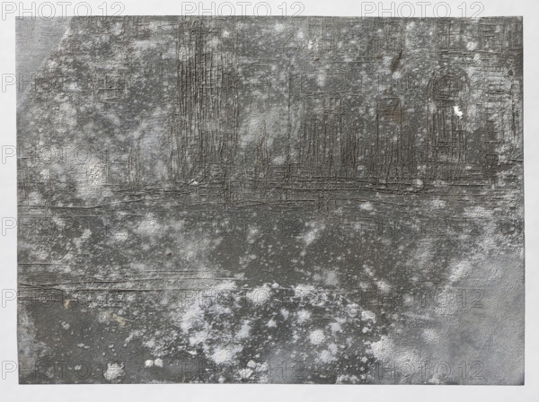 Street in the city; Feliks Jablczynski (1865–1928), graphic artist; cityscape of tenement houses and windows; architectural study; Polish graphic; ca. 1924, Warsaw; graphic matrix/plate; height 8 cm, width 10.8 cm, A textured rectangular surface fills the image, showing a weathered, rough appearance with a mix of gray shades and areas of lighter whitish patches. There are fine linear scratches and grid-like incisions across the upper half, forming vertical and horizontal patterns and suggesting raised ridges. The lower portion has irregular mottled spots and softer cloudy patches in white and pale gray against darker gray areas. Subtle variations include small darker brownish-gray streaks and faint beige flecks in places, with overall tones limited to various grays, whites, and hints of brownish-beige.