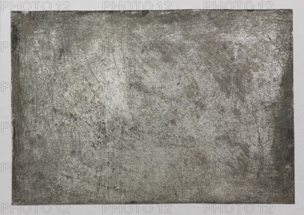 A cutter on the wave — Feliks Jablczynski (1865–1928), graphic artist; ships; water landscapes; landscapes; Polish graphic art; Poland; ca. 1924; graphic art; graphic matrix (graphic plate); height 7.3 cm; width 10.7 cm, A rectangular sheet with a rough textured surface fills most of the image, showing a mottled appearance in shades of gray and silver with areas of darker charcoal and lighter silvery highlights; the sheet has worn, scratched marks and subtle streaks and smudges across its surface, with faint speckles and irregular patches; the sheet is set against a light gray background border that frames it on all sides.