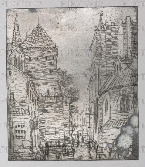 A street in a medieval town; Feliks Jablczynski (1865–1928), graphic artist; tenement houses; landscapes; cityscapes; architectural studies; views; streets; towers; architectural views; cities; city views; Polish graphics; Poland; Gothic style; ca. 1924; Warsaw; graphic; graphic matrix/plate; height 10 cm; width 8.7 cm, The image shows a monochrome etched scene of an old street flanked by tall, textured buildings and towers, rendered in shades of gray, black, and off-white. On the left a round tower with a conical roof and a nearby spire rise above layered rooftops and narrow facades with linear hatch shading; on the right a cluster of taller, vertically lined structures and a building with a pitched roof and arched window sit above sloped roofs and masonry textures. The central street recedes between the buildings, hinted at by sketchy lines and clustered smaller rooftop silhouettes in the distance, while sparse, bare tree-like marks appear among the structures. The overall surface sh...