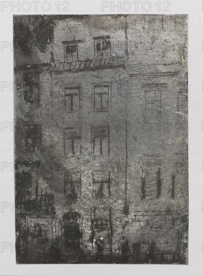 Facades of old tenement houses; verso: Castle in Wisnicz. Jablczynski, Feliks (1865–1928), graphic artist. Polish graphics, ca. 1924. Graphic plate (graphic matrix), graphic; height 6.6 cm, width 9.5 cm. Subjects: castles, tenement houses, streets; location depicted: Wisnicz Stary (Lesser Poland Voivodeship)., The image shows a vertical rectangular scene of a multi-story building facade rendered in textured gray tones with areas of darker charcoal and lighter silvery highlights; the surface appears rough and mottled with scratches and smudges. Several window outlines and recessed door shapes are visible across the facade, drawn with thin dark lines, and a few windows show faint indications of curtains. Near the bottom there are two darker arched doorways and shapes suggesting people or figures standing along the base of the building. A horizontal decorative ledge or cornice runs below the top floor, and a narrow vertical dark line outlines a rain gutter or seam near the center. The ove...