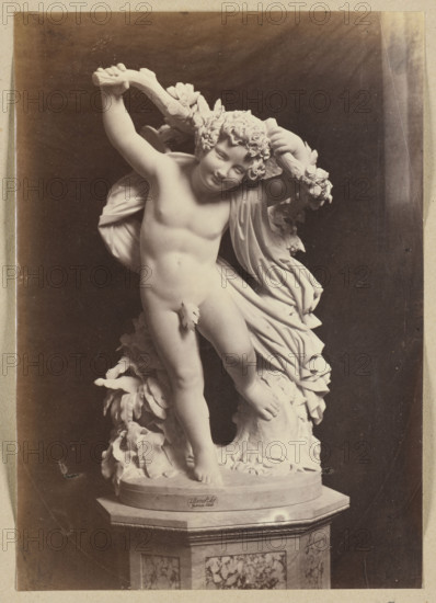 Photograph of a sculpture by Wiktor Brodzki from ca. 1868 depicting a putto with an ivy branch; sculptor: Wiktor Brodzki (1817/1825/1826–1904); photographer/publisher: Lorenzo Suscipj (Rome; photographic studio; 183?-1901); subject: putti, children, nudes (children), branch/plant; medium: photograph/photographic print; dimensions: height 23.5 cm, width 16.6 cm.