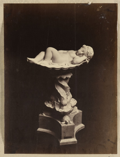 Photograph of the sculpture Cupid sleeping in a shell by Wiktor Brodzki; sculptor Wiktor Polearch Brodzki (1817/1825/1826–1904); photographer/publisher Lorenzo Suscipj (Rome; photographic studio; 183?-1901); subjects: Cupid (myth), children, mythological scene; genre: children's nudes, sculptures, shells; medium: photograph, photographic print; date: ca. 1868; dimensions: height 23.3 cm, width 17.5 cm; place: Rome.