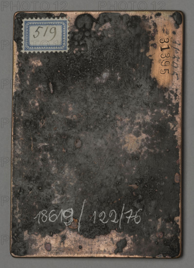 Title: IESVS MATRIS DELICIAE IESVS PATRIS SOLATIVM (The Heavenly and Earthly Trinity) WQXBCFS
I:\nmw crop ready cleaned\ WQXBCFS
I:\nmw crop ready cleaned\Artist/maker: Firens (family of engravers and publishers; active ca. 1580–post 1671 — Pierre Firens, Gaspard Firens, Pierre II Firens) WQXBCFS
I:\nmw crop ready cleaned\ WQXBCFS
I:\nmw crop ready cleaned\Date: ca. 1600–1670 WQXBCFS
I:\nmw crop ready cleaned\ WQXBCFS
I:\nmw crop ready cleaned\Medium: Print; graphic plate (engraving) WQXBCFS
I:\nmw crop ready cleaned\ WQXBCFS
I:\nmw crop ready cleaned\Dimensions: height 9.6 cm; width 6.6 cm; thickness 0.15 cm WQXBCFS
I:\nmw crop ready cleaned\ WQXBCFS
I:\nmw crop ready cleaned\Subject and description: Devotional engraving depicting the Holy Family and the Holy Trinity. Three figures stand in a landscape: St. Joseph holding a lily, Mary with a book, and the infant Jesus in the center holding both of their hands. At their feet are two kneeling, praying faithful. In the clouds a...