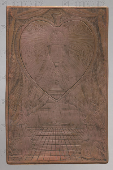 Angels adoring the Blessed Sacrament. The engraving depicts a chalice with a host within rays framed in the shape of a heart, with curtains in the background. The Blessed Sacrament is adored by two angels kneeling at the bottom. Image of the Blessed Sacrament which the angels worship. Part of a series of graphic compositions depicting images that are objects of worship, mostly made by anonymous engravers, often in Vilnius monastery engraving workshops. After 1700. Graphic plate (graphic matrix). Height 9.7 cm, width 6.3 cm. Made by graphic artist; attributed to engravers active in Lithuania (some in Lublin and Ventspils). Tyszkiewicz reference: Monuments of engraving, p. 31, item 139.