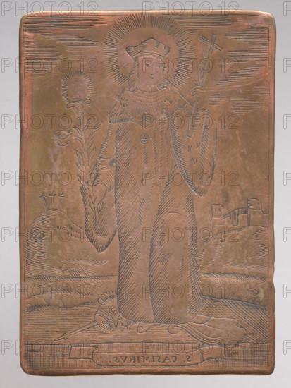 Saint Casimir. Figure of a standing saint with a cross and a lily in his hands, a biretta on his head, a crown and scepter at his feet; in the background on the left a castle on a hill, on the right Trzykrzyska Mountain. Casimir (1458–1484), born in Krakow, second of six sons of Casimir Jagiellon; his mother Elizabeth, daughter of Emperor Albert II Habsburg. Tutor Jan Dlugosz wrote: 'He was a noble youth, of rare abilities and a mind worthy of memory.' Casimir died in 1484 and was buried in the Chapel in Vilnius Cathedral. The image belongs to a series of graphic compositions depicting images that were objects of worship, mostly created by anonymous engravers, often in monastery engraving workshops. After 1800. Graphic; graphic matrix/plate. Height 8.8 cm, width 6.1 cm.