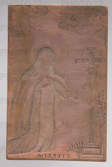 Saint Teresa of Avila. Teresa of Jesus (St.; 1515–1582) — iconography. Catholic saint shown kneeling in a Carmelite habit before a crucifix; at top left an angel with a wreath. Background, face and hands partially stippled. Graphic plate (graphic matrix), height 8.6 cm, width 5.5 cm. After 1800, Vilnius. Made by anonymous engraver(s); part of a series of graphic compositions depicting images that were objects of worship.