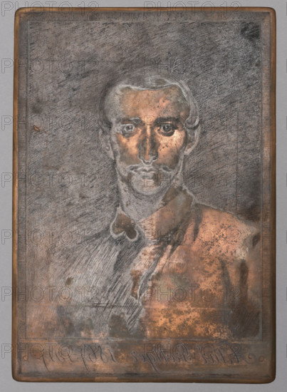 Portrait of Artur Grottger after a self-portrait; Ignacy Lopienski (1865–1941), graphic artist; Artur Grottger (1837–1867), painter; male portrait, iconography of Artur Grottger; bust of Artur Grottger, almost straight on; 1917; Warsaw; graphic plate; height 23.4 cm, width 16.4 cm, A rectangular metal plate with a framed border features an engraved portrait of a man shown from the chest up; the man has short hair, a mustache and beard, and a serious facial expression with prominent eyes, nose, and lips rendered with fine etched lines. The background and much of the figure show crosshatched and scratched textures, with areas of smooth engraving on the face and collar; the plate surface exhibits spots, blotches, and patches of oxidation giving mottled patterns. Visible colors include coppery brown, dark gray, black, and lighter silvery gray highlights, with the framed edge appearing slightly warmer in tone. The composition is centered vertically and horizontally on the plate, and the ove...