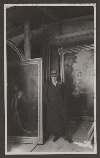 Vilnius. Cathedral. 'Cleaning of Cathedral Paintings - Jerzy Hoppen'; photographer: Edmund and Boleslawa Zdanowscy; subject: Jerzy Hoppen (1891–1969) cleaning cathedral paintings in Vilnius, Lithuania; medium: photograph, photographic print; dimensions: print 13.5 × 8.3 cm; album page 16.4 × 24.5 cm; date: before 1939.