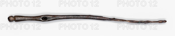 Clothes pin, Northern Mesopotamian workshop, pins for fastening garments; short pin with a straight shaft of circular cross-section. In the upper part there is a conical extension terminating in a small round head, separated by a notch. Below the head, at 1/4 length, there is a slight flattening on the shaft, which contains a hole for passing a string through. 1st half of the 3rd millennium BC; Early Jazira III period (Early Dynastic III; c. 2600–c. 2350 BC). Tell Jassa el Gharbi (northeastern Syria), Northern Mesopotamia (Khabur basin). Pin (clasp). Total length 10.76 cm; diameter 0.1 cm (minimum)–0.4 cm (maximum); middle part width 0.45 cm (flattened), thickness 0.25 cm (flattened); hole diameter 0.2 cm.