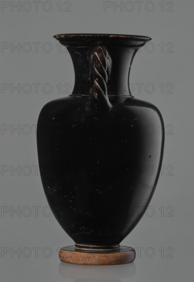 Black-finished amphora, engobe, amphoras, ancient vessels, reddish clay. Surface finished with a glossy black engobe. Amphora with a disc-shaped base. Pear-shaped belly with clearly defined shoulders. Short neck separated from the shoulders by a ring. Wide, outward-curving rim. Two twisted handles (S2 twist), attached vertically between the neck and the shoulders. No engobe on the base. Preservation condition: slight losses in the lower part of the belly and on the rim. 5th century BC, Attica, vessel, amphora, height 21 cm, width 12 cm
