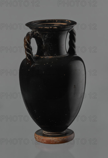Black-finished amphora, engobe, amphoras, ancient vessels, reddish clay. Surface finished with a glossy black engobe. Amphora with a disc-shaped base. Pear-shaped belly with clearly defined shoulders. Short neck separated from the shoulders by a ring. Wide, outward-curving rim. Two twisted handles (S2 twist), attached vertically between the neck and the shoulders. No engobe on the base. Preservation condition: slight losses in the lower part of the belly and on the rim. 5th century BC, Attica. Vessel, amphora. Height 21 cm, width 12 cm.