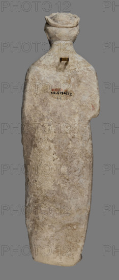 Votive figure of a youth holding a bird, votive offering, Cypriot sculpture. Figurine of a youth shown standing, left arm down at his side holding a 'handkerchief', right arm bent and raised with open palm facing front. Dressed in a chiton and himation; folds of the chiton marked with slightly wavy shallow lines, folds of the himation highlighted with engraved schematic lines. Relatively small head with regular features, visible eyes, straight nose, and traces of red polychrome on the lips. Hairstyle of small curled locks arranged in two rows; hair decorated with a diadem showing traces of red polychrome. Back of the sculpture unfinished. Date: 480–310 BC (previous dating: first half of the 5th century BC). Origin: Cyprus. Sculpture dimensions: height 43 cm, width 14 cm, depth 14 cm; weight 3.03 kg.