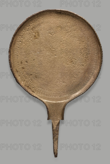 Hand mirror with a scene of the slaying of Medusa; workshop from Chiusi; late 4th century BC; medium: mirror; subject: Medusa (mythology), hand mirrors; height 27.9 cm, width 17.5 cm, depth 0.5 cm, weight 0.64 kg.