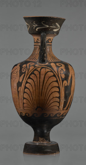 Red-figure amphora, Apulian workshop, repossession; Classical Period vessel (3rd quarter of the 4th century BC), Apulia (Italy). Wide, tapering foot supporting a cylindrical stem merging into a belly with short horizontal handles that arch into a narrow neck topped by a tall, diagonally widening spout with floral ornamentation. Neck decorated with a wavy ornament at the top and an ingot-shaped lower section. Two ribbon-like handles run from the shoulders to the lower edge of the rim. Both sides of the body bear painted figurative scenes. Side A: a naked man and a clothed woman standing opposite each other with an altar between them; the man holds a bowl in his outstretched left hand with a cloak slung over it, his right arm down and weight on his left leg; the woman wears a long chiton fastened at the shoulders and tied at the waist. Side B: two young men facing each other wearing cloaks; the young man on the right leans on a long stick with his right arm outstretched. Beneath the hand...