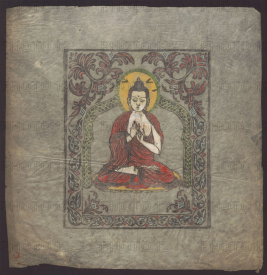 Shakyamuni Buddha, Tibetan Buddhist art, Himalayan art, Nepalese art, Tibetan, Himalayan, plant (ornament), lotus throne, ushnisha, Buddhism. Colored woodcut depicting Shakyamuni Buddha in a frame with a plant motif, 1st half of the 20th century, Nepal, print, height 39.2 cm, width 38.0 cm., A framed painted image on textured gray paper showing a seated figure in a meditative pose wearing red robes, with pale skin and dark hair tied in a topknot, a circular yellow halo behind the head, and hands held together near the chest; the figure sits on a cushion with red and yellow tones. The framed area contains an ornate arch and border decorated with scrolling floral and leaf motifs in green, red, blue, black, and gray, with patterned detailing; the outer margins of the sheet are mottled gray with creases and slight discoloration.