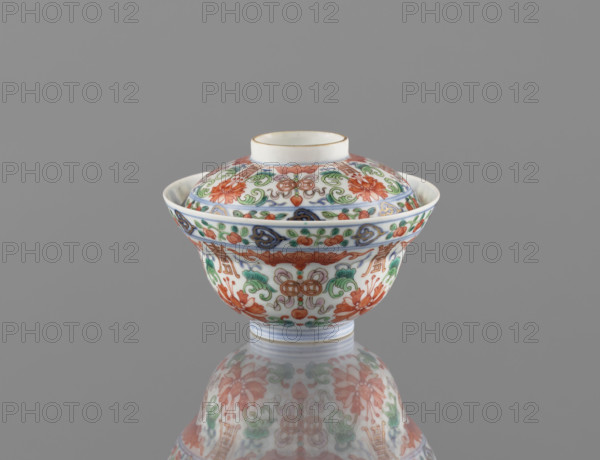 Bowl with a lid; Chinese colored porcelain; Qing dynasty (1644–1911), Qianlong period/style (1736–1795); decorated with bats, longevity shou, lotus tendrils, lotuses, and peaches; vessel; height 9 cm, diameter 10.7 cm; dated 1736–1795.