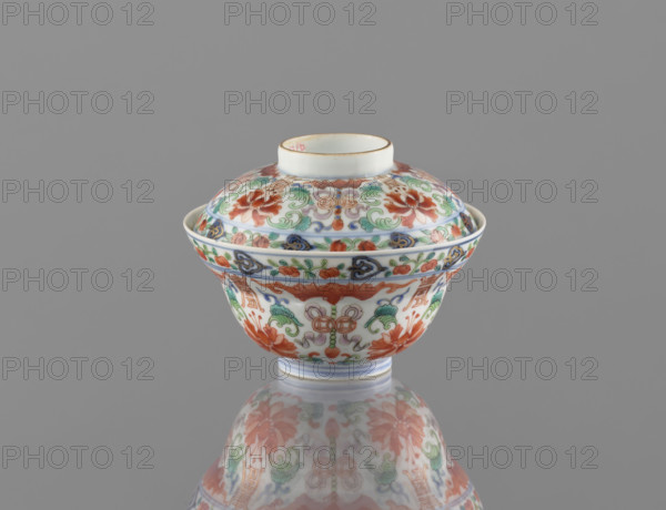 Bowl with a lid; Chinese colored porcelain; Qing dynasty, Qianlong period/style (1736–1795); decorated with bats, longevity shou, lotus tendril ornament, lotuses, and peaches; vessel; height 9 cm, diameter 10.7 cm; dated 1736–1795; maker unknown.
