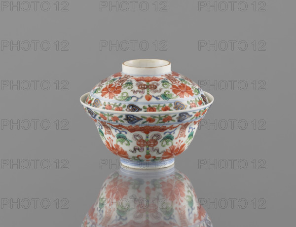 Bowl with lid; Chinese, Qing dynasty (style of Qianlong, 1736–1795); porcelain with polychrome enamels; decorated with bats, longevity shou, lotus tendrils, lotuses, and peaches; vessel height 9 cm, diameter 10.7 cm; dated 1736–1795.