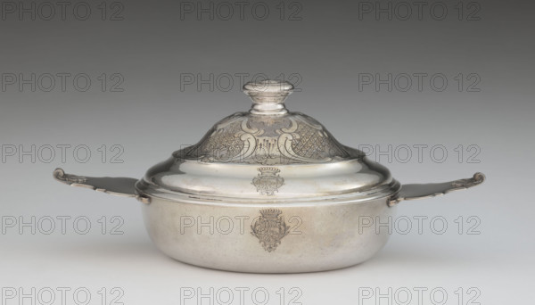 Écuelle by Louis I Dulaurier, goldsmith; tableware element. Body in the form of a smooth, circular bowl with two horizontal handles ending in shells. The arched cover is decorated with racailles and a grid, with a handle bearing a relief male bust wearing a laurel wreath. Engraved on both parts is a coat of arms under a count's crown (three-field: right, a tower on a rock on an azure field; left, two bulls on a gold field; above, three stars on a blue field). Dated 1690, 1760–1761. Toulouse. Vessel: height 13 cm, width 28.8 cm, depth 17.2 cm.
