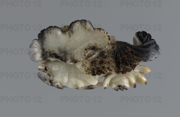 Fish under a lotus flower and leaf — paperweight; maker Rubiec-Masalski, Fyodor Vasilyevich (1865–1920?); materials/technique: sculpture; subject: fish, lotuses, leaf, flowers; associated figures/themes: scholars, officials, writing instruments, Chinese symbols; style/period: Qing (1644–1911), Qing style, 19th century China; dimensions: height 10.7 cm, width 6.0 cm.