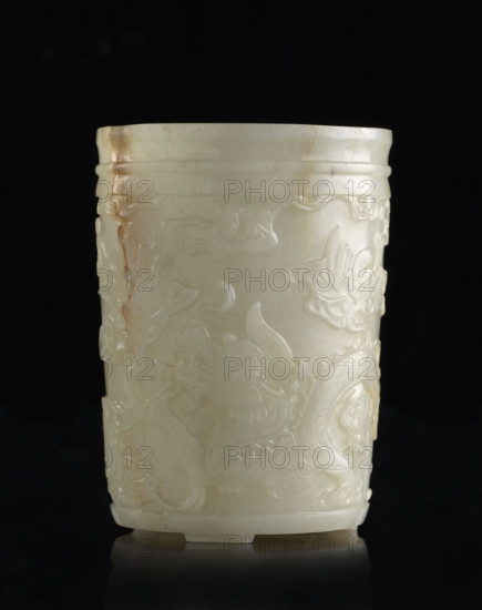 Brush vessel, by Fyodor Vasilyevich Rubiec-Masalsky (1865-1920?), Chinese, Qing (1644–1911) style, 19th century China. Porcelain vessel, height 12.2 cm, width 9.0 cm. Decoration: bats, dragons, phoenixes (fenghuang), clouds, Chinese symbols; associated with writing instruments, officials, scholars. Mention of Tulisov, George (1943– ) removed.