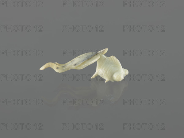 Fish-shaped paperweight; subject: fish; culture: Chinese, Qing dynasty (1644–1911); object type: paperweight; date: 19th century; country: China; decoration noted; dimensions: height 3.5 cm, width 11.0 cm, depth 6.5 cm.