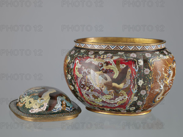 Vase with cover, Japanese, Meiji period (late 19th century, 1868–1912); cloisonné enamel; decorated with phoenix (hoo), flowers, plant ornaments, geometric patterns, dragons (Japanese dragon motif); vessel; height 6.0 cm, width 26.0 cm, depth 19.5 cm.