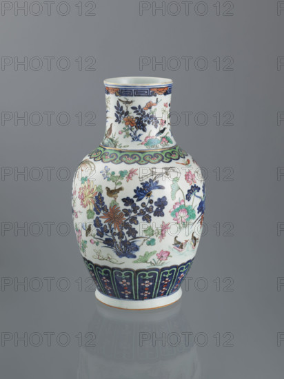Vase, Chinese, Qing dynasty (1644–1911), 19th century; decorative vessel decorated with peonies, phoenixes, butterflies, lotuses, plum trees, cranes, chrysanthemums, birds, and meander ornament; height 39.5 cm, diameter 18.5 cm.
