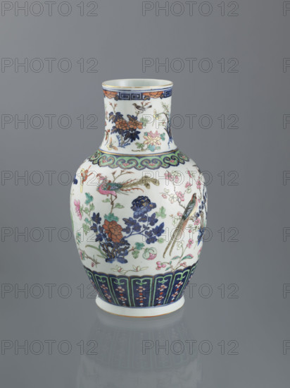 Vase, Chinese, Qing dynasty (1644–1911), 19th century; decorative vessel depicting peonies, phoenixes, butterflies, lotuses, plum trees, cranes, chrysanthemums, birds, and meander ornament; height 39.5 cm, diameter 18.5 cm.