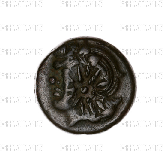 Bronze coin, Pantikapaion; obverse: head of a beardless Satyr in an ivy wreath facing left with a twelve-pointed star countermark; reverse: lion's head with a gaping mouth facing left, below it a sturgeon facing left, letters at sides and top, countermark (bow in a quiver) on the head. Iconography: Satyr's head, lion's head, countermarks, bow in a quiver, twelve-pointed star, stars, sturgeons, fish, lions, animals, bows, weapons, armament, gorytos, quivers. Early 3rd century BC, Cimmerian Bosporus, Pantikapaion. Coin: bronze; diameter 19.4–20.1 mm; weight 7.70 g; axis 330°.