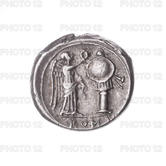 Victoria (personification); Jupiter (mythology); head of Jupiter; trophies; Victoria crowning; laurel wreath (attribute); Obverse: Head of Jupiter in a laurel wreath at right. Pearl border. Reverse: Victoria facing right crowns the trophy; under the line the inscription ROM. Continuous border. Date: 211–208 BC, Roman Republic (505–27 BC), Sicily. Coin; diameter 16.5 mm; weight 3.09 g; axis 45 degrees. Maker: Wladyslaw Semerau-Siemianowski (1849–1938).