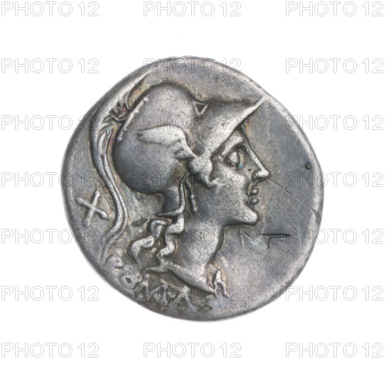 Denarius; obverse: head of Roma in a Corinthian helmet facing right; below inscription ROMA; behind her the value mark X; beaded border. Reverse: Roma in a Corinthian helmet seated right on a stack of shields, holding a spear in her left hand; at her feet a helmet; in front a she-wolf nursing twins; birds flying on either side; beaded border. Punches. 115–114 BC, Roman Republic; Rome. Coin; diameter 19.5 mm; weight 3.83 g; axis 270°.