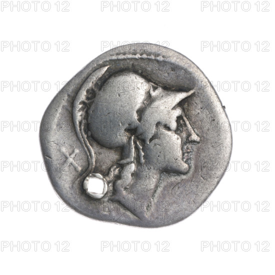 Denarius; obverse: head of Roma in a Corinthian helmet right; below the inscription; behind her the sign of value X; beaded border. Reverse: Roma wearing a Corinthian helmet sits facing right on a stack of shields, holding a spear in her left hand; a helmet at her feet; in front a she-wolf feeding twins; flying birds on either side; pearl border. 115–114 BC; Roman Republic; Rome. Coin; diameter 20.6 mm; weight 3.47 g; axis 180°.