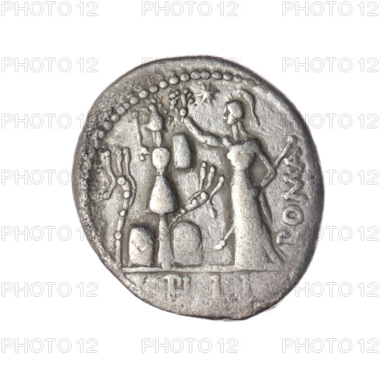 Denarius, M. Furius Philus (fl. 119 BC), Obv.: Head of Janus in a laurel wreath; inscription M.FOVRI.L.; beaded border. Rev.: Roma in a Corinthian helmet, with sceptre in left hand, crowning a trophy with right hand; above a star; inscription ROMA; on both sides of the trophy a carnyx and a shield; under the line the inscription PHILI (PHI in ligature); pearl border. 119 BC, Roman Republic; Rome. Coin; diameter 18.9 mm; weight 3.72 g; axis 0°.