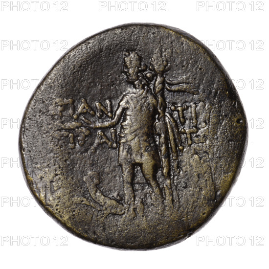 Bronze coin, Pantikapaion; 1st quarter of the 1st century BC (95–65 BC according to Frolov 2002 and 1999); Cimmerian Bosporus. Obverse: head of Attys in a Phrygian cap decorated with stars and in a laurel wreath facing right; at the top a crescent and a star. Reverse: Dionysus in a short robe standing three-quarters left, holding a bunch of grapes in his right hand and a thyrsus with a ribbon in his left; a panther sits left at his feet with its head turned; monogram at right field; inscription in two rows on the sides. Iconography: panthers, standing Dionysus, head of Attys, crescent with a star, head of Men, grapes, plants, male head; monograms. Coin type: dia. 30.6–31.2 mm, weight 18.60 g, axis 0°.