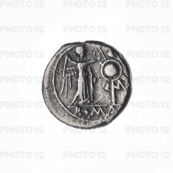 Victorian; publisher. Obv: Head of Jupiter in a laurel wreath at right. Pearl border. Rev: Victoria crowning the trophy turned at right; inscription ROMA below the line. Continuous border. Subject: Jupiter (mythology), Victoria (personification), laurel wreath (attribute), trophies. Maker: Sabat, Bronislaw (1871-1953). Date: 211 BC, Roman Republic (505–27 BC). Object: coin (Rome). Diameter 16.0 mm; weight 2.69 g; axis 135°.